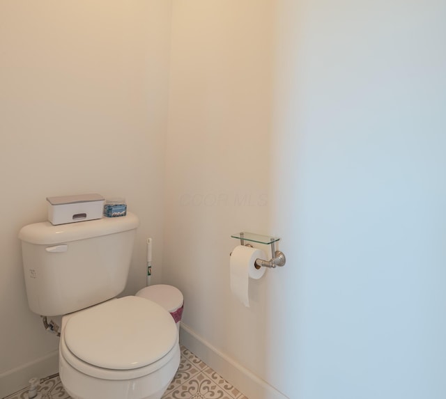 9295 Dewitt Dr, Plain City, OH 43064 - bathroom featuring baseboards and toilet