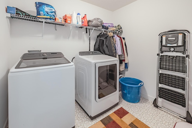 9295 Dewitt Dr, Plain City, OH 43064 - washroom featuring washer and dryer, laundry area, and baseboards