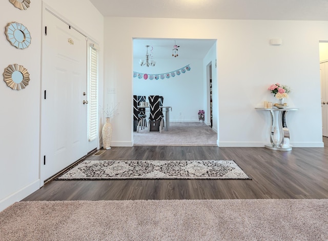 9295 Dewitt Dr, Plain City, OH 43064 - foyer entrance with baseboards, wood finished floors, and a chandelier