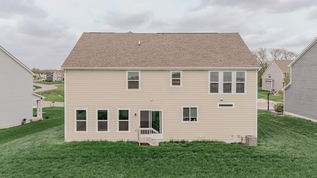 9295 Dewitt Dr, Plain City, OH 43064 - rear view of property with a yard, central AC unit, and a shingled roof