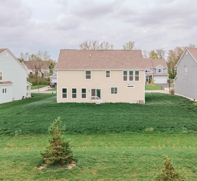 9295 Dewitt Dr, Plain City, OH 43064 - back of house featuring a yard and a residential view