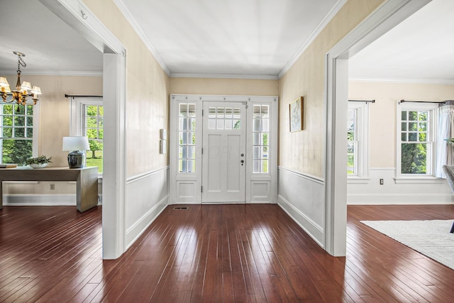 1812 Newark Granville Rd, Granville, OH 43023 - foyer entrance featuring a chandelier, dark wood-style flooring, wainscoting, baseboards, and ornamental molding