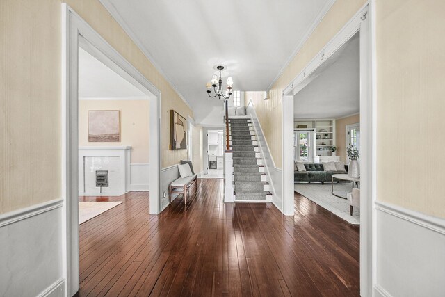 1812 Newark Granville Rd, Granville, OH 43023 - entryway with a chandelier, crown molding, stairs, hardwood / wood-style flooring, and wainscoting