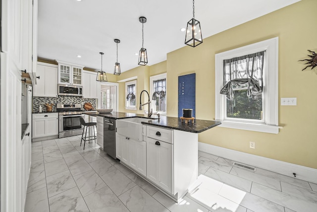 1812 Newark Granville Rd, Granville, OH 43023 - kitchen featuring appliances with stainless steel finishes, light marble finish flooring, a sink, baseboards, and recessed lighting