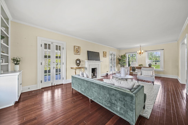 1812 Newark Granville Rd, Granville, OH 43023 - living area featuring french doors, dark wood-type flooring, ornamental molding, a chandelier, and baseboards
