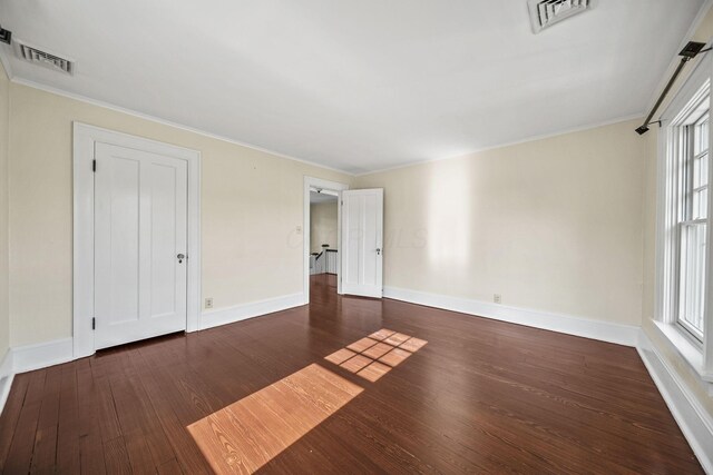 1812 Newark Granville Rd, Granville, OH 43023 - unfurnished bedroom with wood finished floors, baseboards, multiple windows, and crown molding