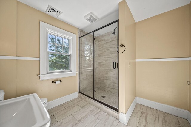 1812 Newark Granville Rd, Granville, OH 43023 - bathroom featuring marble look tile flooring, baseboards, a shower stall, and toilet
