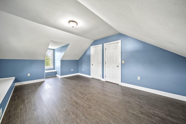1812 Newark Granville Rd, Granville, OH 43023 - additional living space featuring dark wood-type flooring, lofted ceiling, and baseboards