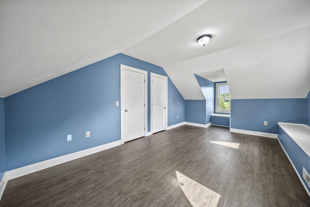 1812 Newark Granville Rd, Granville, OH 43023 - additional living space with lofted ceiling, dark wood-style flooring, and baseboards