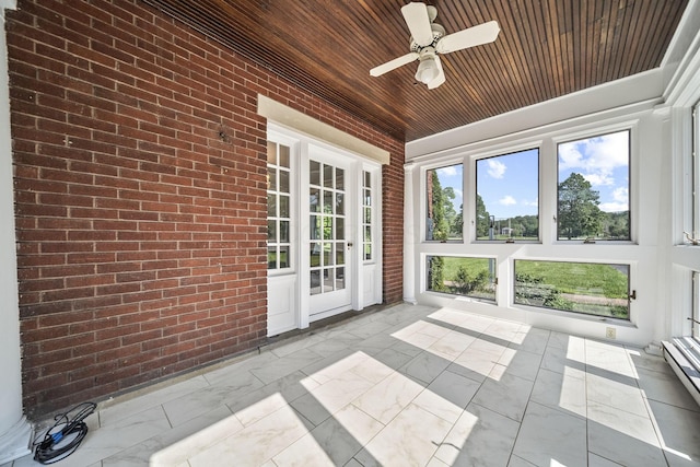 1812 Newark Granville Rd, Granville, OH 43023 - unfurnished sunroom featuring wooden ceiling, marble finish floors, brick wall, and a baseboard radiator
