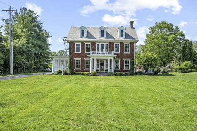 1812 Newark Granville Rd, Granville, OH 43023 - colonial-style house featuring brick siding, a chimney, and a front lawn