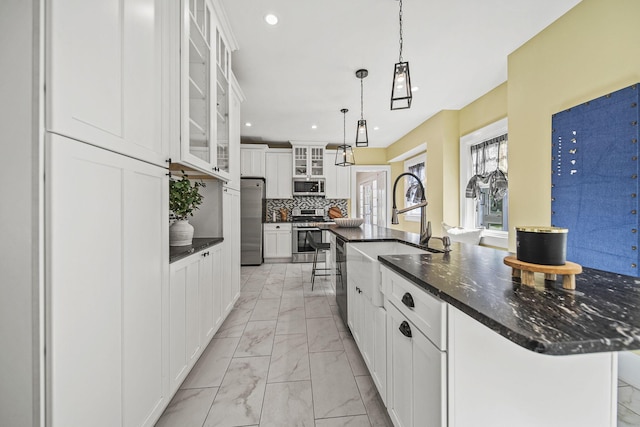 1812 Newark Granville Rd, Granville, OH 43023 - kitchen with appliances with stainless steel finishes, light marble finish flooring, recessed lighting, white cabinets, and tasteful backsplash