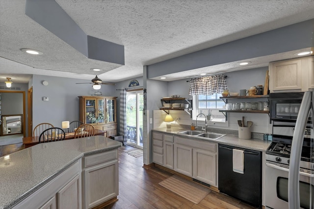 kitchen featuring a textured ceiling, open shelves, a sink, black appliances, and dark wood-style floors