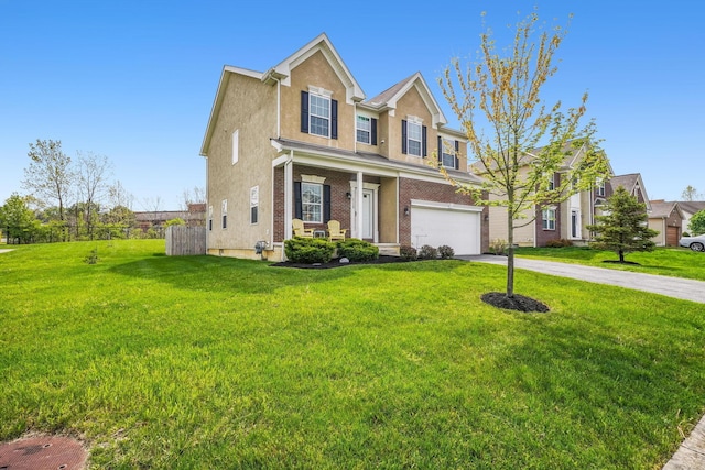 2128 Clay Stone Pl, Reynoldsburg, OH 43068 - traditional-style house featuring concrete driveway, stucco siding, a porch, a front lawn, and a garage
