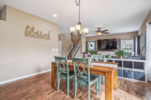 2128 Clay Stone Pl, Reynoldsburg, OH 43068 - dining space featuring recessed lighting, wood finished floors, ceiling fan with notable chandelier, baseboards, and stairway