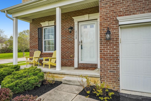 2128 Clay Stone Pl, Reynoldsburg, OH 43068 - property entrance with covered porch and brick siding