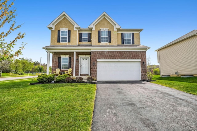 2128 Clay Stone Pl, Reynoldsburg, OH 43068 - traditional-style house with driveway, stucco siding, a porch, a front lawn, and a garage