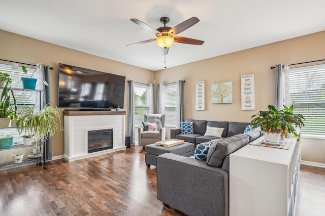 2128 Clay Stone Pl, Reynoldsburg, OH 43068 - living room with baseboards, wood finished floors, ceiling fan, and a glass covered fireplace