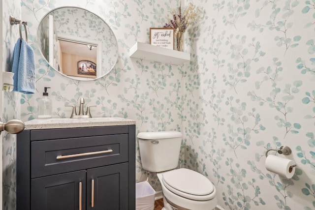 2128 Clay Stone Pl, Reynoldsburg, OH 43068 - half bathroom featuring vanity, toilet, and wallpapered walls
