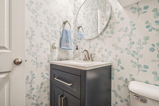 2128 Clay Stone Pl, Reynoldsburg, OH 43068 - half bathroom featuring toilet, wallpapered walls, and vanity
