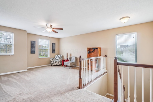 2128 Clay Stone Pl, Reynoldsburg, OH 43068 - sitting room featuring an upstairs landing, ceiling fan, carpet floors, and baseboards