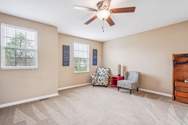 2128 Clay Stone Pl, Reynoldsburg, OH 43068 - living area with a ceiling fan, carpet flooring, visible vents, and baseboards