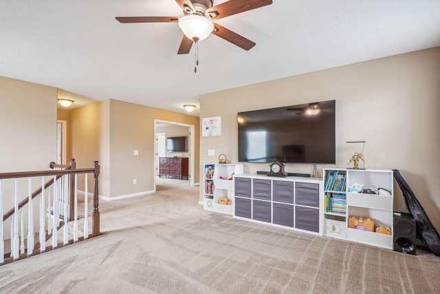 2128 Clay Stone Pl, Reynoldsburg, OH 43068 - living area featuring a ceiling fan, carpet floors, and baseboards