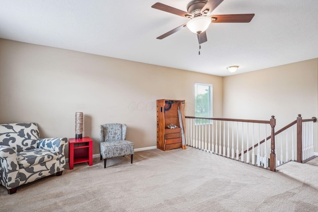 2128 Clay Stone Pl, Reynoldsburg, OH 43068 - living area with baseboards, a ceiling fan, carpet floors, and an upstairs landing
