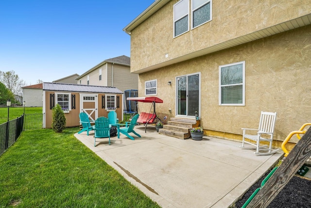 2128 Clay Stone Pl, Reynoldsburg, OH 43068 - rear view of house with entry steps, a patio area, stucco siding, fence, and a yard