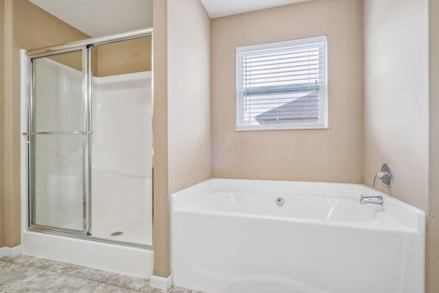 2128 Clay Stone Pl, Reynoldsburg, OH 43068 - full bathroom featuring a garden tub and a shower stall