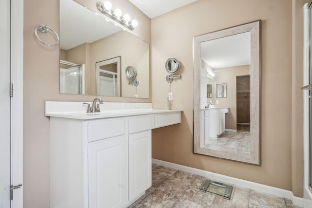 2128 Clay Stone Pl, Reynoldsburg, OH 43068 - bathroom featuring baseboards, a shower stall, and vanity