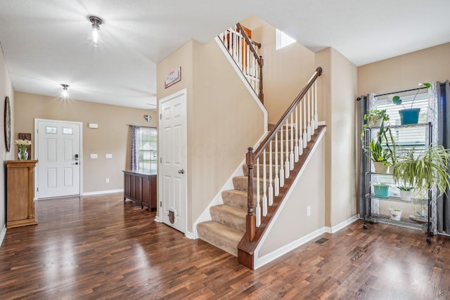 2128 Clay Stone Pl, Reynoldsburg, OH 43068 - foyer entrance featuring visible vents, stairway, wood finished floors, and baseboards