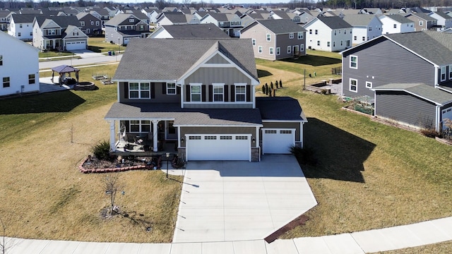 birds eye view of property with a residential view