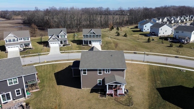 birds eye view of property with a residential view