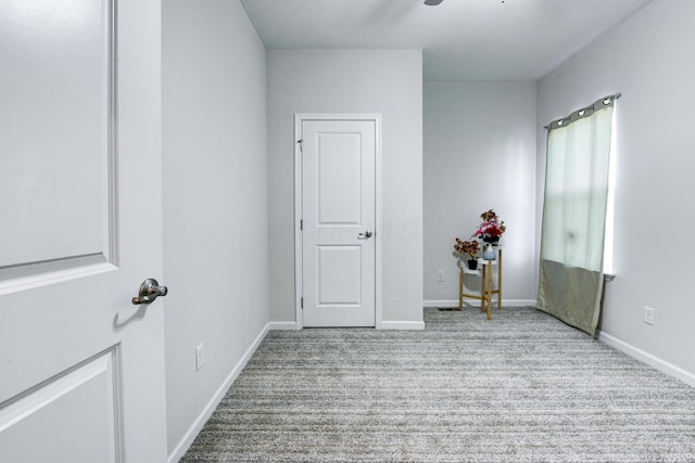 bedroom with baseboards and carpet flooring