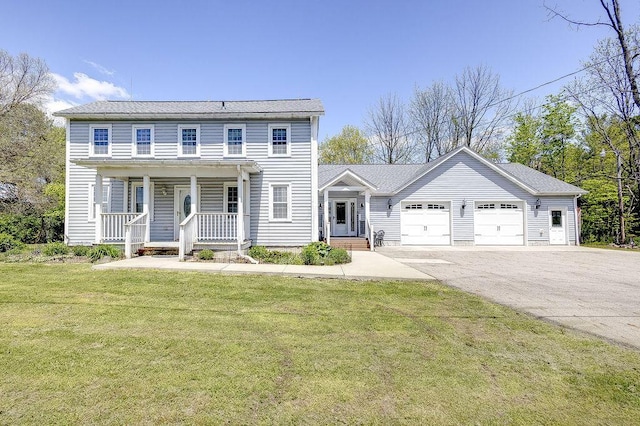 8028 Concord Rd, Johnstown, OH 43031 - view of front facade with an attached garage, a porch, asphalt driveway, and a front yard