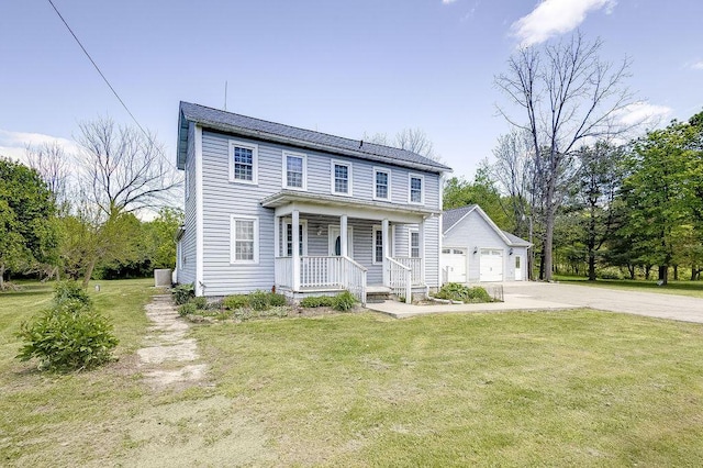 8028 Concord Rd, Johnstown, OH 43031 - view of front of home with covered porch, a front lawn, and driveway