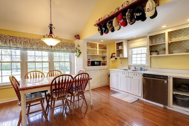 8028 Concord Rd, Johnstown, OH 43031 - kitchen featuring stainless steel dishwasher, open shelves, a sink, wood finished floors, and vaulted ceiling