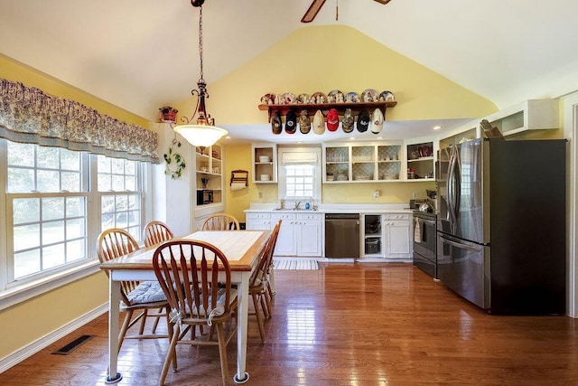 8028 Concord Rd, Johnstown, OH 43031 - dining room with dark wood-type flooring, high vaulted ceiling, and a ceiling fan