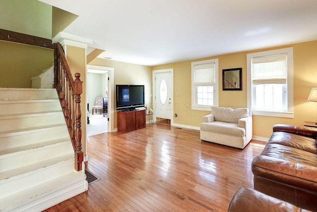 8028 Concord Rd, Johnstown, OH 43031 - living room with stairway, light wood-style floors, and baseboards