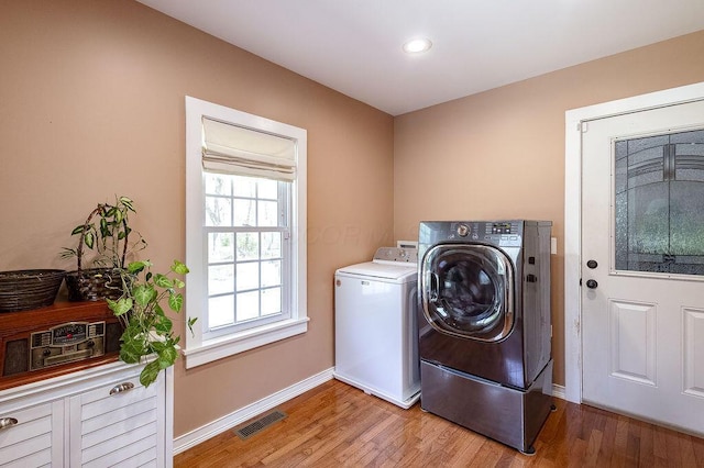 8028 Concord Rd, Johnstown, OH 43031 - washroom featuring washer and clothes dryer, baseboards, light wood-type flooring, and recessed lighting