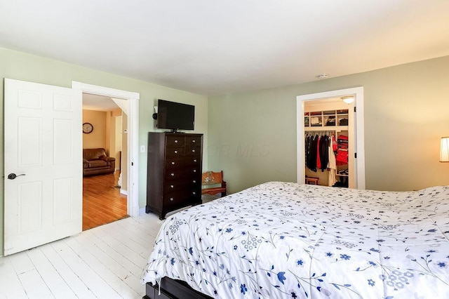 8028 Concord Rd, Johnstown, OH 43031 - bedroom with light wood-style floors, a spacious closet, and a closet
