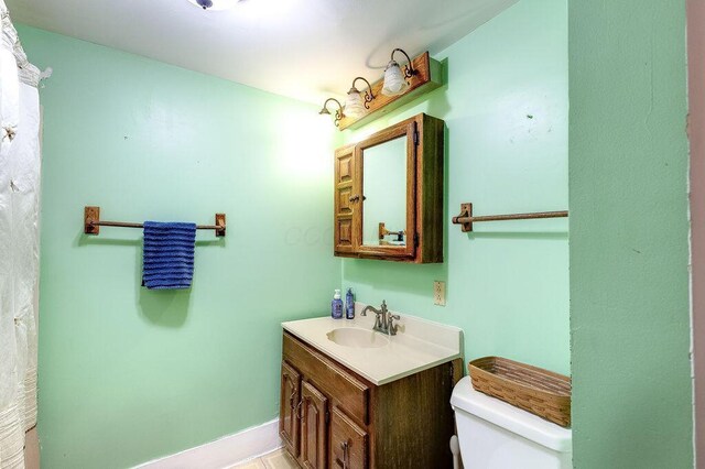 8028 Concord Rd, Johnstown, OH 43031 - bathroom with toilet, vanity, and baseboards