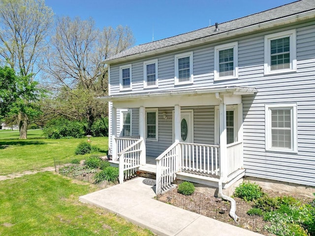 8028 Concord Rd, Johnstown, OH 43031 - view of front facade featuring covered porch and a front lawn