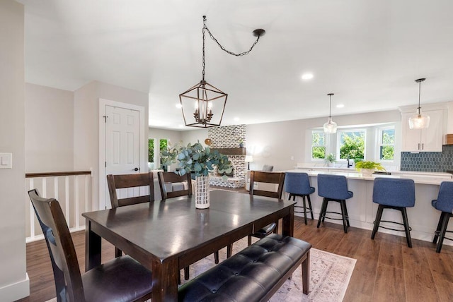 dining room featuring dark wood-type flooring, recessed lighting, and a wealth of natural light