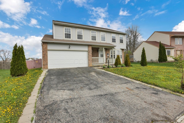 577 Stable St, Pataskala, OH 43062 - traditional-style home featuring brick siding, fence, aphalt driveway, a garage, and a front yard