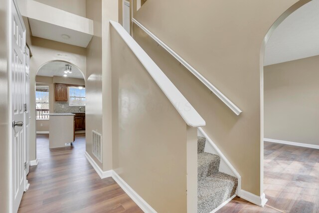 577 Stable St, Pataskala, OH 43062 - stairs featuring wood finished floors, visible vents, and arched walkways