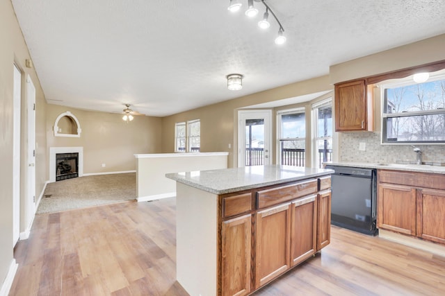 577 Stable St, Pataskala, OH 43062 - kitchen with black dishwasher, ceiling fan, light wood finished floors, and a sink