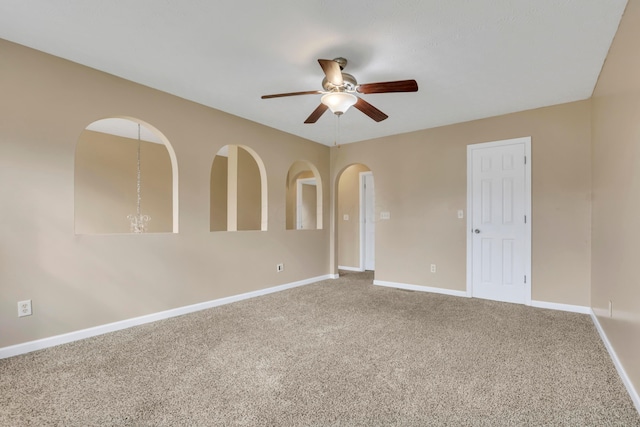 577 Stable St, Pataskala, OH 43062 - spare room featuring a ceiling fan, arched walkways, carpet, and baseboards