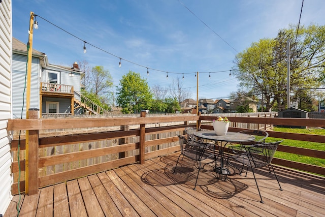 deck with fence and outdoor dining space
